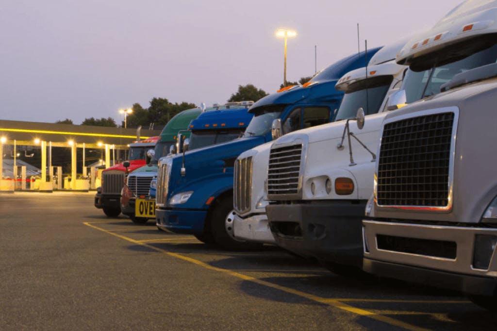 several semi trucks in a parking lot
