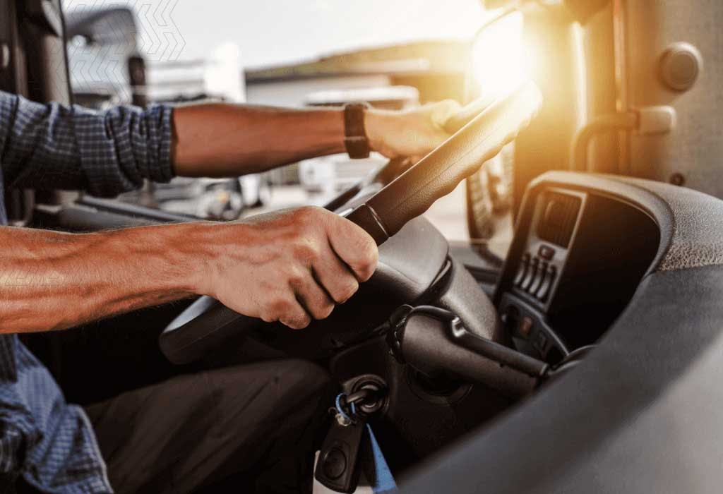 Carrier hands on the steering wheel