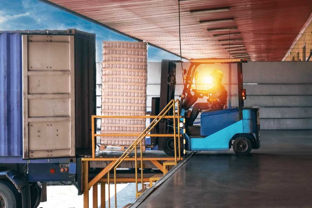 Truck being loaded on a dock.
