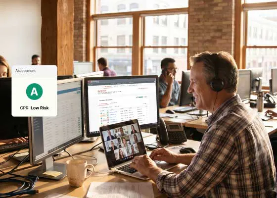 Broker using Carrier Hub at their desk with a Low Risk CPR assessment shown
