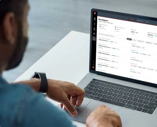 Broker reviewing the Shipper Hub My Shippers view on a laptop