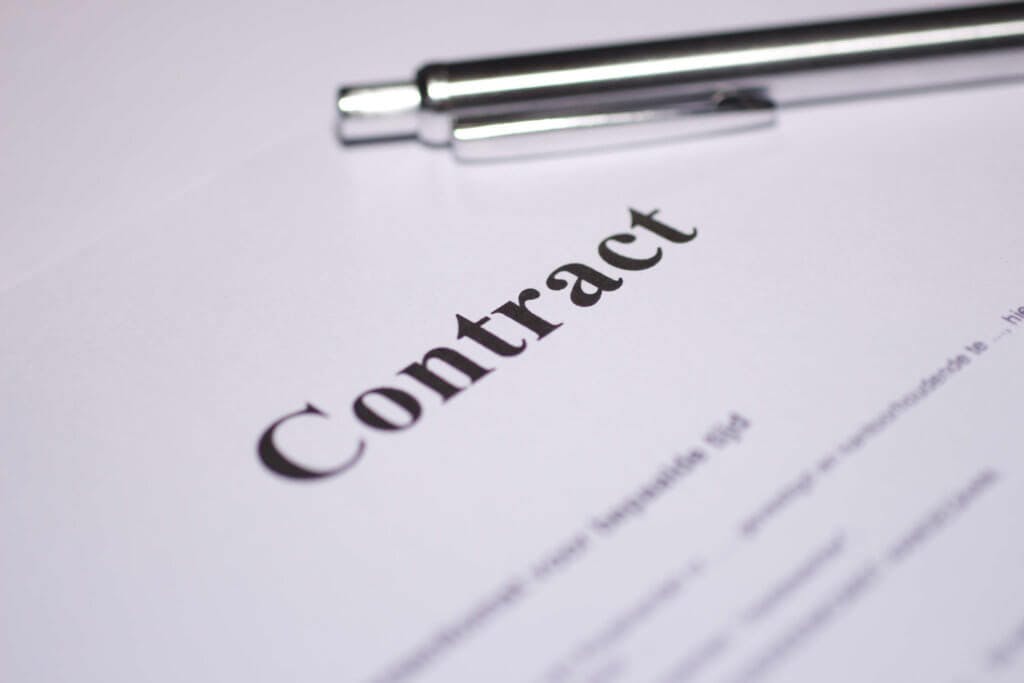 Paper contract with pen