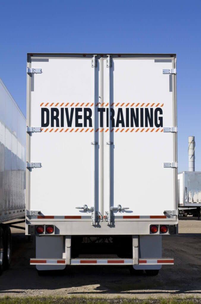 Back of trailer with Driver Training printed across the doors.