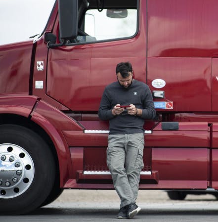 Ilia Jakeli, a Truckstop customer, using his smartphone to find and book truck loads on the load board.