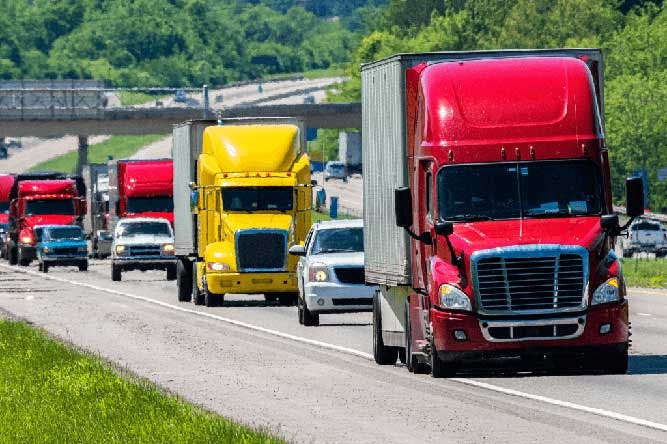 freight trucks traveling on highway during transportation