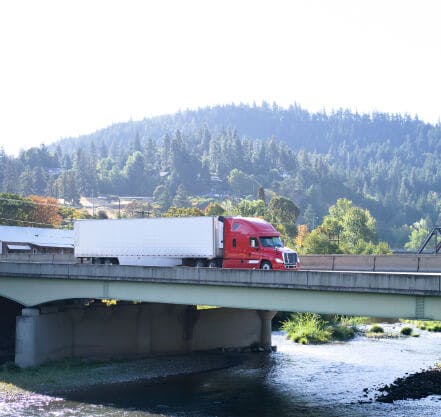 a truck pulls a reefer trailer