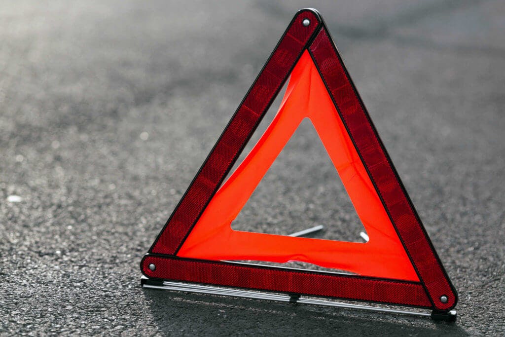 Hazard triangle on asphalt.