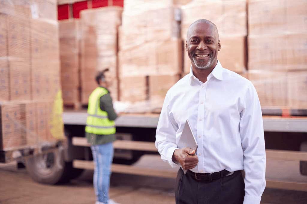 person standing in from of loaded trailer