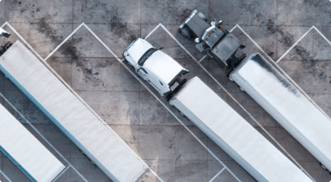 Aerial view of trucks parked in a lot.