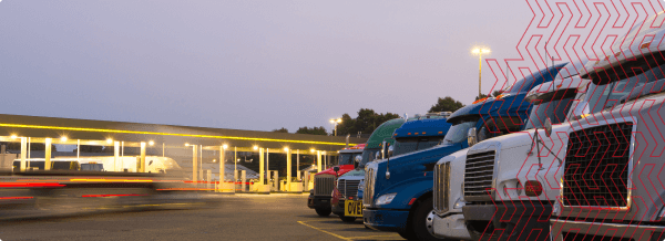 Trucks parked at a truckstop.